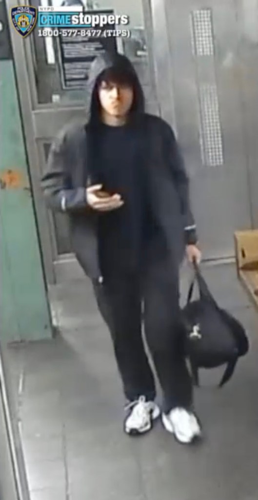 A person wearing a black hoodie and carrying a black bag, with "Crime Stoppers" and a phone number overlay.