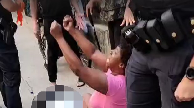 Cellphone footage obtained by The News shows a woman in pink with the victim screaming "Jesus!" and "Oh my f------ God!" as she sits beside his body, surrounded by police.