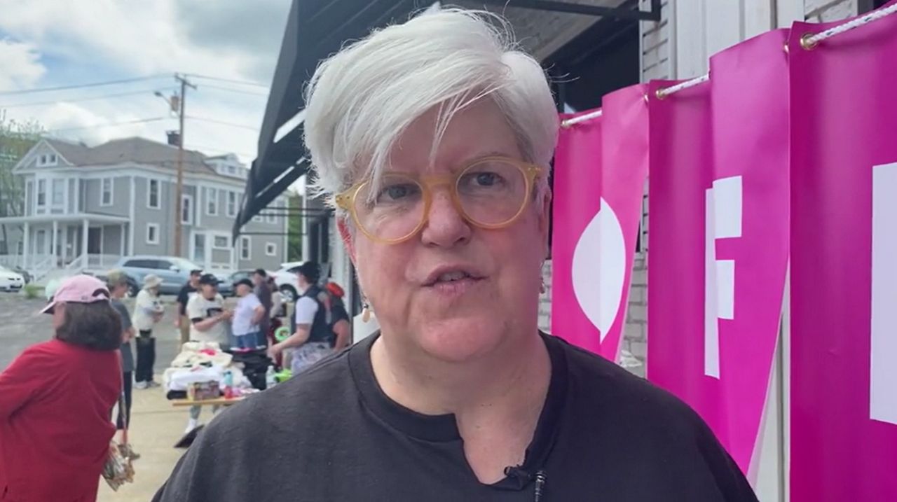 woman speaking at rally