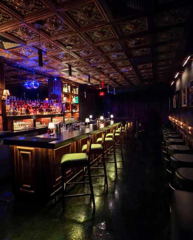 The entrance to The Brooklyn Room speakeasy inside the Common Room restaurant is hidden behind a bookcase. (Common Room/Courtesy)