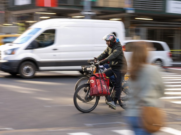 An e-bike rider travels south on 2nd Ave. near E. 86th St. in Manhattan on Friday, Oct. 24, 2025 in Manhattan, New York. (Barry Williams/ New York Daily News)