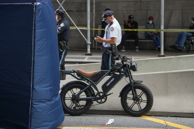 NYPD officers and detectives investigate a fatal e-bike collision on Centre St. near Chambers St. in Lower Manhattan on Wednesday, July 29, 2026 in New York City.