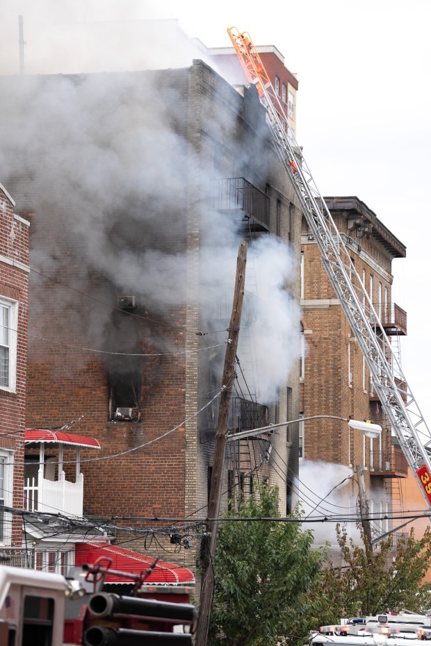 FDNY firefighters on the scene during a massive Bronx fire in a five-story apartment building on E. 209th St. in the Bronx on Wednesday, Aug. 5, 2026. (Barry Williams/ New York Daily News)