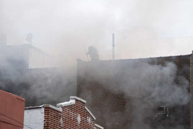FDNY firefighters work the scene during a massive Bronx fire in a five-story apartment building on E. 209th St. near Parkside Place in the Bronx on Wednesday, Aug. 5, 2026.. (Barry Williams/ New York Daily News)