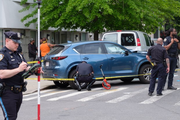 The NYPD Highway Patrol investigates after a pedestrian was fatally struck by a driver who fled the scene on Knickerbocker Avenue and Eldert Street in Bushwick, Brooklyn, New York City on Thursday, May 9, 2024. (Gardiner Anderson for New York Daily News)