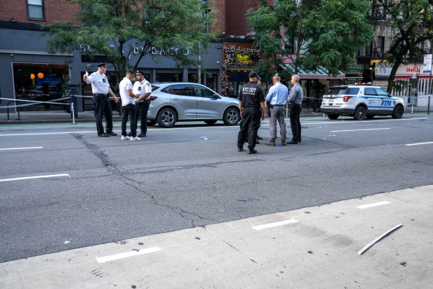 Police investigate after a 66-year-old man was fatally struck by a hit-and-run driver while crossing 9th Ave. mid-block near W. 55th St. in Hell's Kitchen, Manhattan, on Saturday, Aug. 8, 2026. (Theodore Parisienne / New York Daily News)