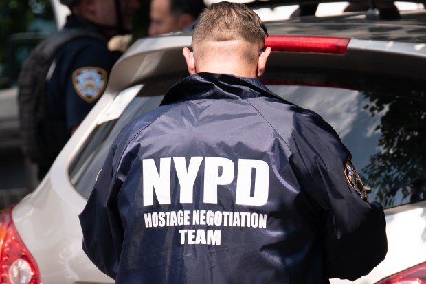 Police searching for a man reported to have a gun and who reportedly ran into 147-17 Ferndale Avenue ended up arresting a barebacked, tattooed man in Queens on Friday July 31, 2026. 1327. (Theodore Parisienne / New York Daily News)
