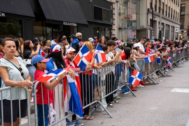 Revelers attend the Dominican Day Parade on 6th Ave. in Manhattan on Sunday, Aug. 11, 2024. (Theodore Parisienne for New York Daily News)