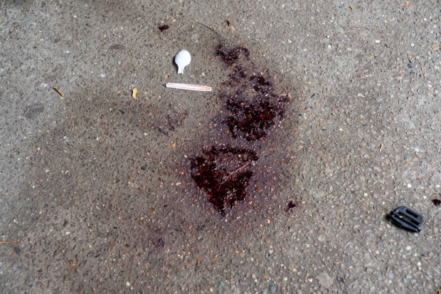 Blood is pictured after a masked gunman shot eight people at a Fourth of July cookout on W. 30th St. in Coney Island, Brooklyn on Saturday, July 4, 2026. (Theodore Parisienne / New York Daily News)