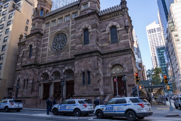 NYPD vehicles are pictured outside Central Synagogue on Lexington Ave. in Manhattan on Saturday, Nov. 11, 2023. (Theodore Parisienne for New York Daily News)