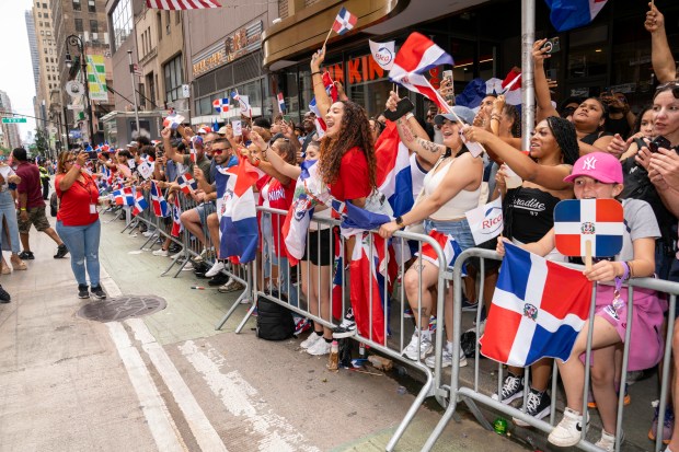 Revelers attend the Dominican Day Parade on 6th Ave. in Manhattan on Sunday, Aug. 11, 2024. (Theodore Parisienne for New York Daily News)