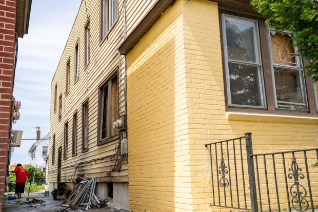 A dog and a canary died and three people suffered minor injuries after a fire inside a home on 202nd St. in Queens on Saturday, Aug. 1, 2026. (Theodore Parisienne / New York Daily News)