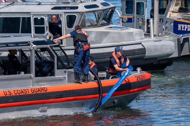 An explosion destroyed a boat that was docked at the City Island Marina in the Bronx on Saturday August 29, 2026. 1356. (Theodore Parisienne / New York Daily News)