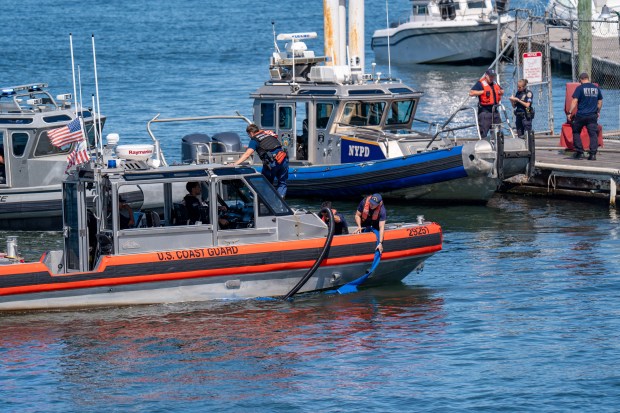 An explosion destroyed a boat that was docked at the City Island Marina in the Bronx on Saturday August 29, 2026. 1356. (Theodore Parisienne / New York Daily News)