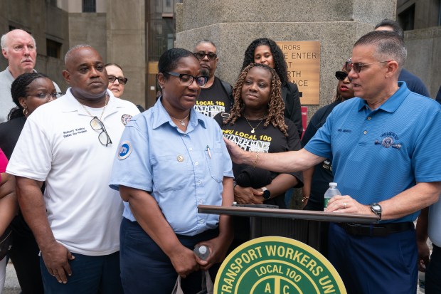 John Chiarello, TWU Local 100 President, comforts MTA station agent Tamika Davis after Robert Ray's sentencing in Manhattan Supreme Court Thursday, Aug. 6, 2026 in Manhattan, New York. Ray seriously assaulted Davis in 2024. (Barry Williams/ New York Daily News)
