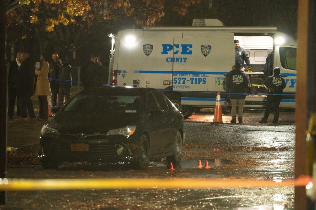 NYPD officers and detectives investigate after Chase Lockard, an alleged member of the "Slutty Gang," was shot and wounded by police on White Plains Road near Lafayette Ave. in the Bronx on Friday, Nov. 22, 2024. (Barry Williams/ New York Daily News)