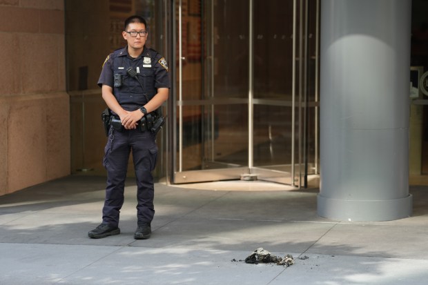 Police investigate after a man allegedly set himself on fire outside a building on Hudson St. in Manhattan on Friday, Aug. 28, 2026. (Barry Williams / New York Daily News)