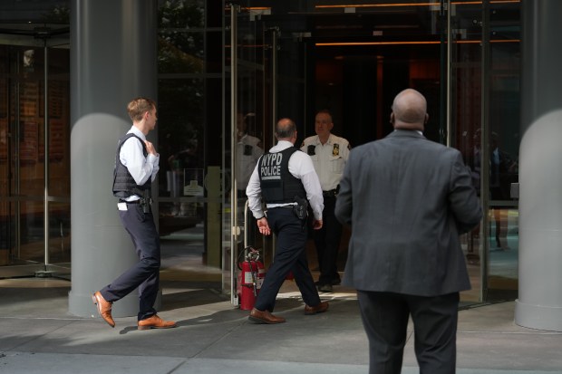 Police investigate after a man allegedly set himself on fire outside a building on Hudson St. in Manhattan on Friday, Aug. 28, 2026. (Barry Williams / New York Daily News)