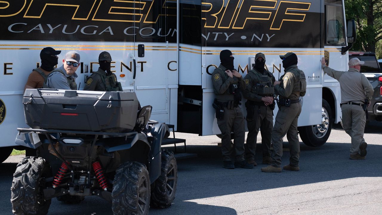 Federal agents at the Cato ice raid.