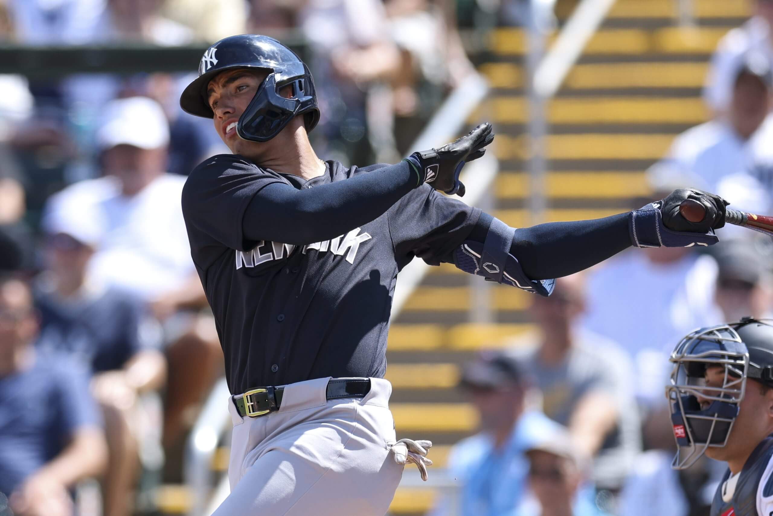 George Lombard Jr. follows through on his swing after hitting a two-RBI single against the Twins in a spring training game.