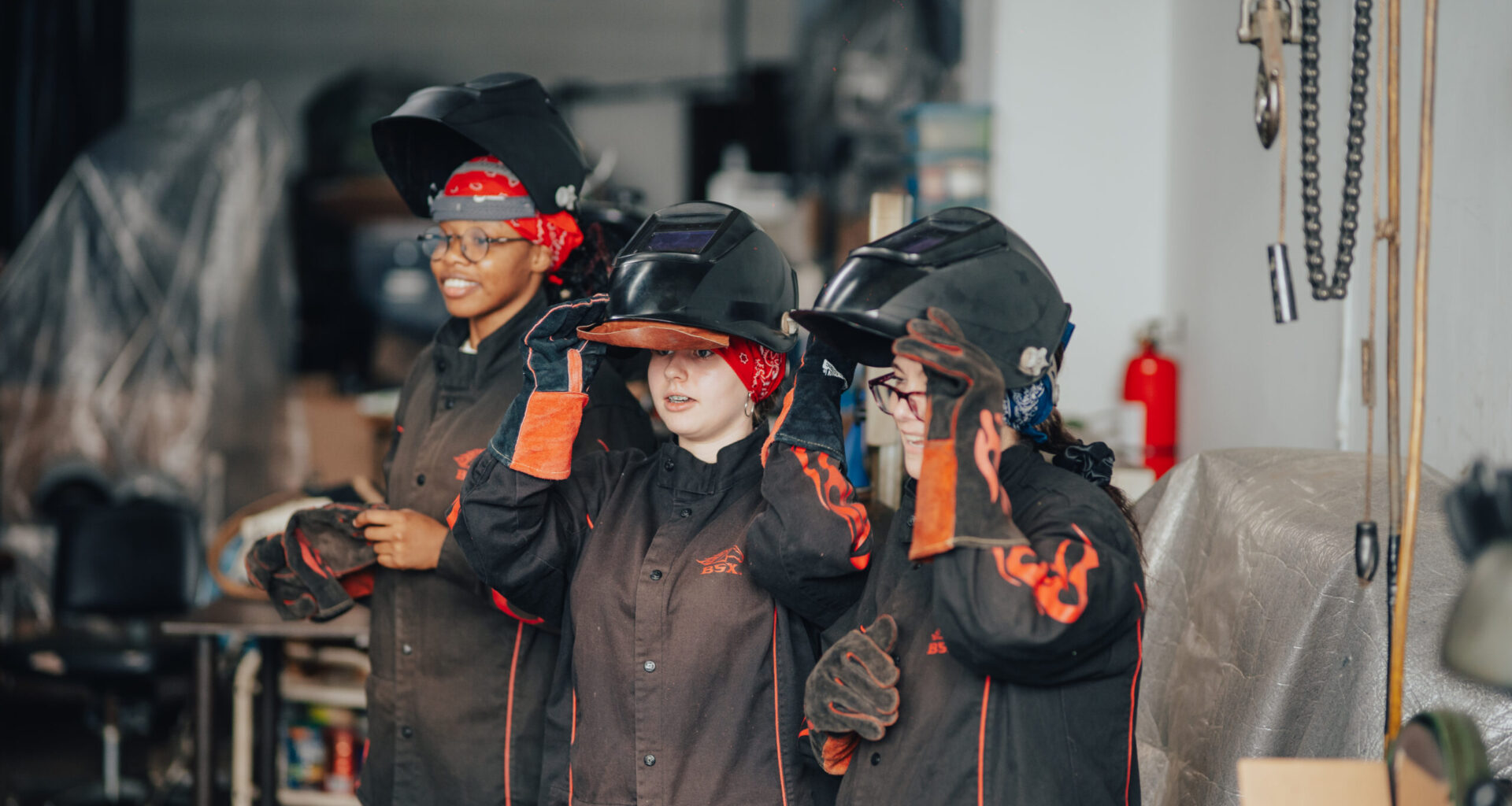 Young women and their mothers learned to fabricate wearable metal pieces at the Brooklyn Navy Yard’s ‘Weld and Wear’ workshop. Photo: Brooklyn Navy Yard