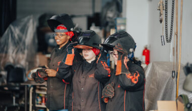Young women and their mothers learned to fabricate wearable metal pieces at the Brooklyn Navy Yard’s ‘Weld and Wear’ workshop. Photo: Brooklyn Navy Yard