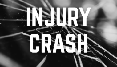 Driver injured after vehicle crashes into tree line in Manhattan