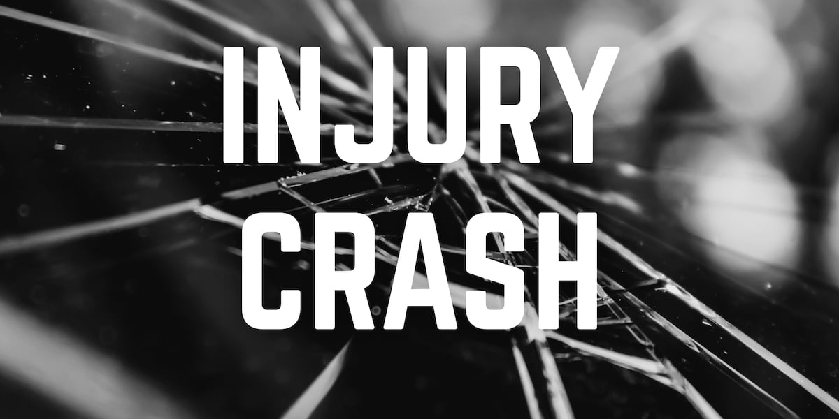 Driver injured after vehicle crashes into tree line in Manhattan