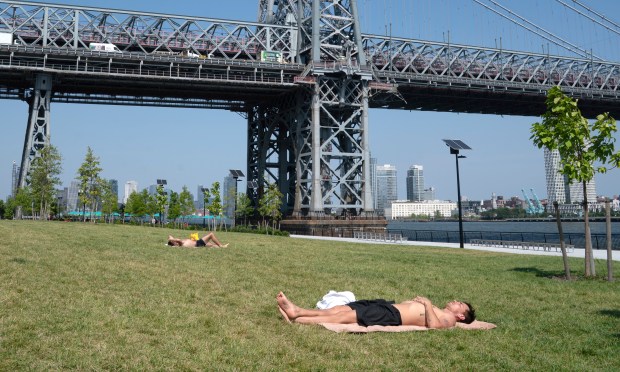 Visitors at East River Park South brave the hot weather Tuesday, Aug. 12, 2025 in Manhattan, New York. (Barry Williams/ New York Daily News)
