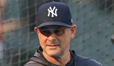 Manager Aaron Boone #17 of the New York Yankees walks to home plate during a game against the Texas Rangers at Globe Life Field on April 29, 2026 in Arlington, Texas