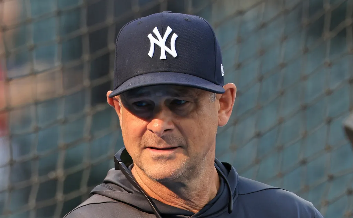 Manager Aaron Boone #17 of the New York Yankees walks to home plate during a game against the Texas Rangers at Globe Life Field on April 29, 2026 in Arlington, Texas