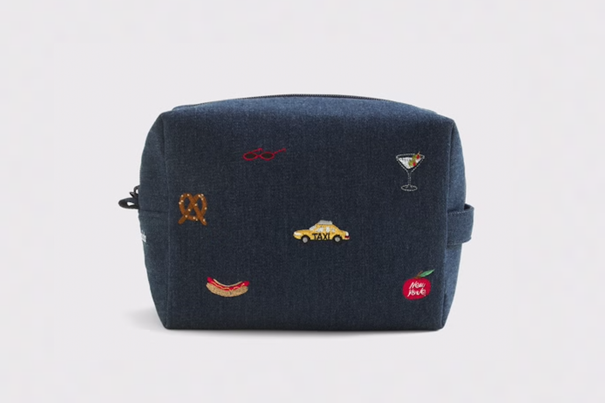 Denim pouch with embroidered New York City themed icons.