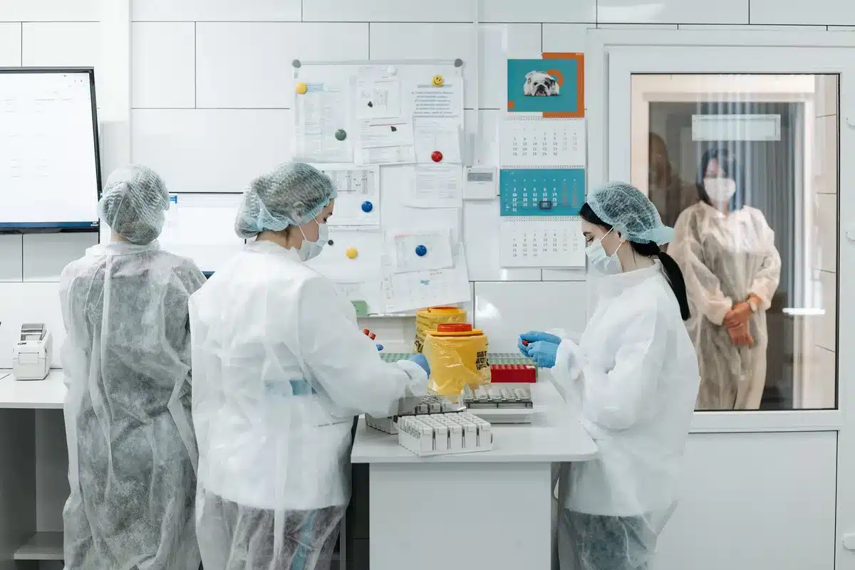 An empty modern biotech laboratory space with rows of benches and equipment, natural light streaming through large windows, waiting for researchers to arrive, suggesting potential and anticipation.