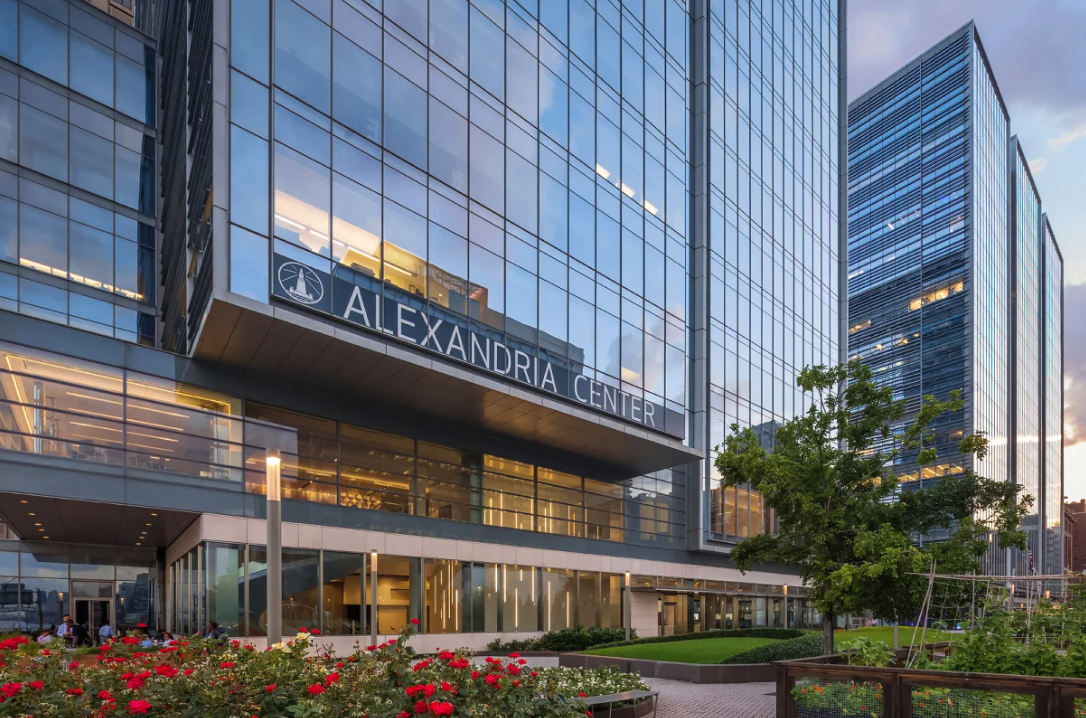 Glass building labeled "Alexandria Center" with reflective windows