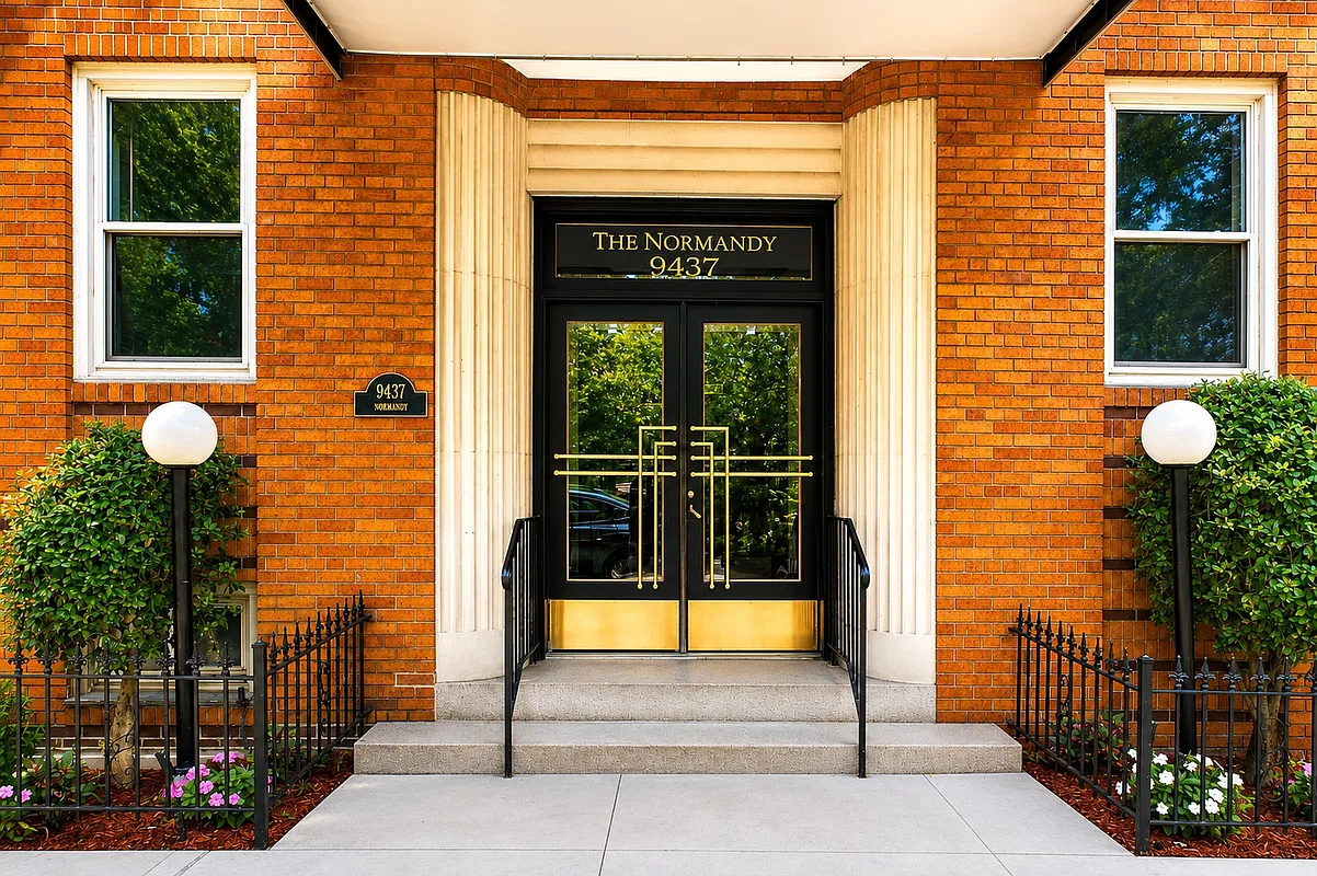 entry with fluted surround and "The Normandy" written in the glass transom
