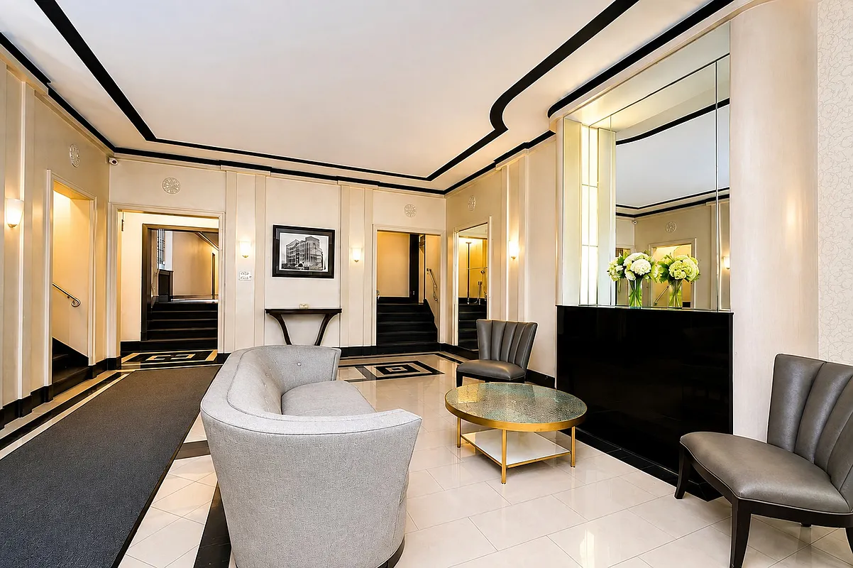 lobby with tile floor, mantel, seating