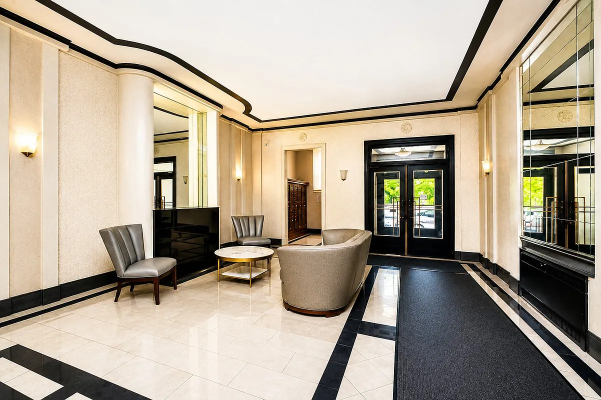 lobby with tile floor, mantel, seating