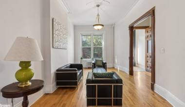 parlor with wood floor, ceiling medallion