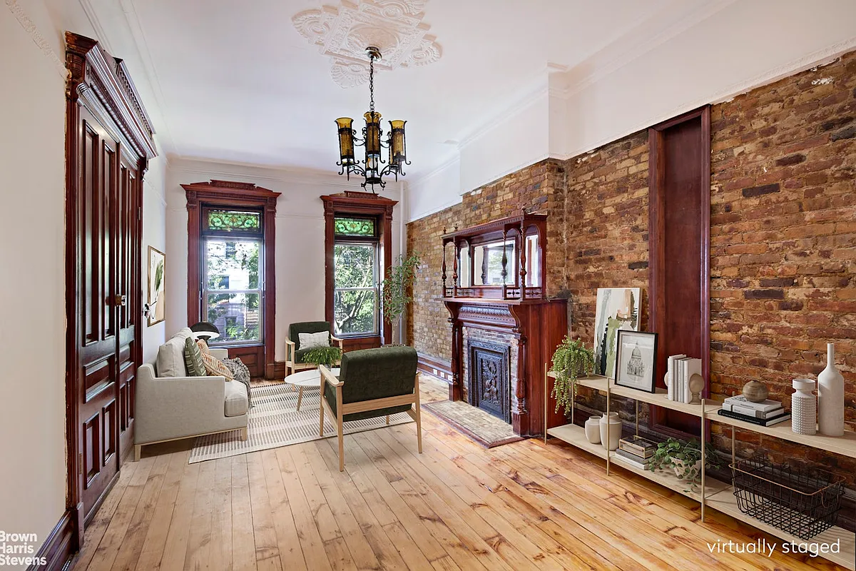 parlor with ceiling medallion, exposed brick