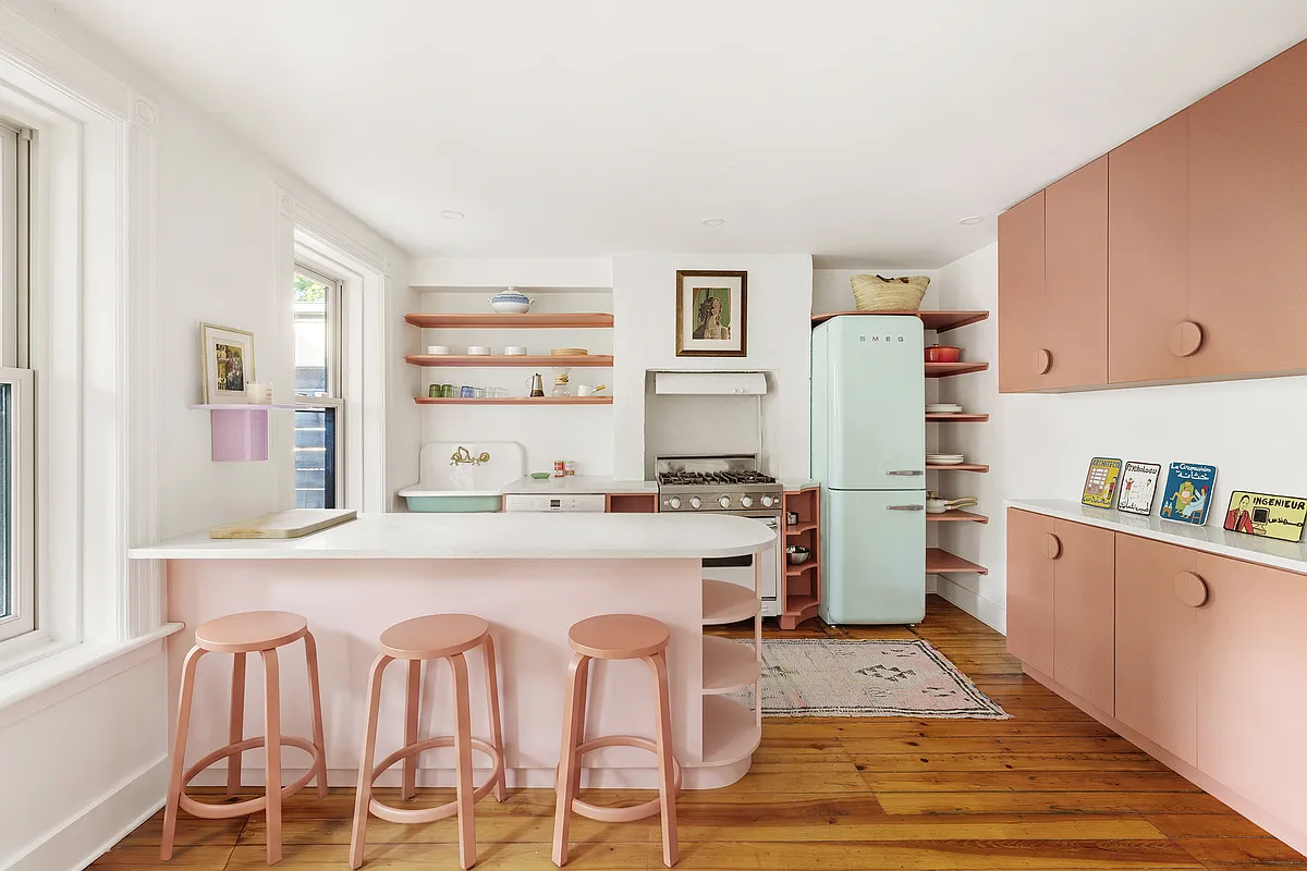 garden level kitchen with pink cabinets and island