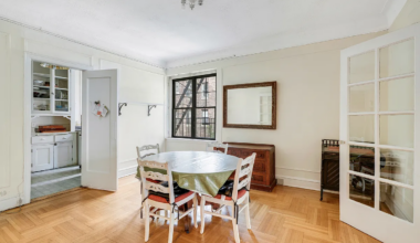 brooklyn heights - dining room with wall moldings, wood floor, view into kitchen