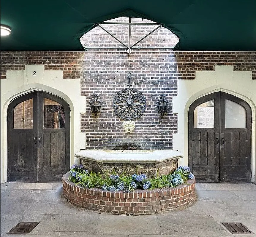 building entrance with a fountain