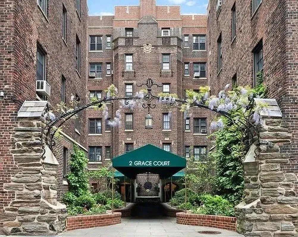 brick building with a green entrance awning