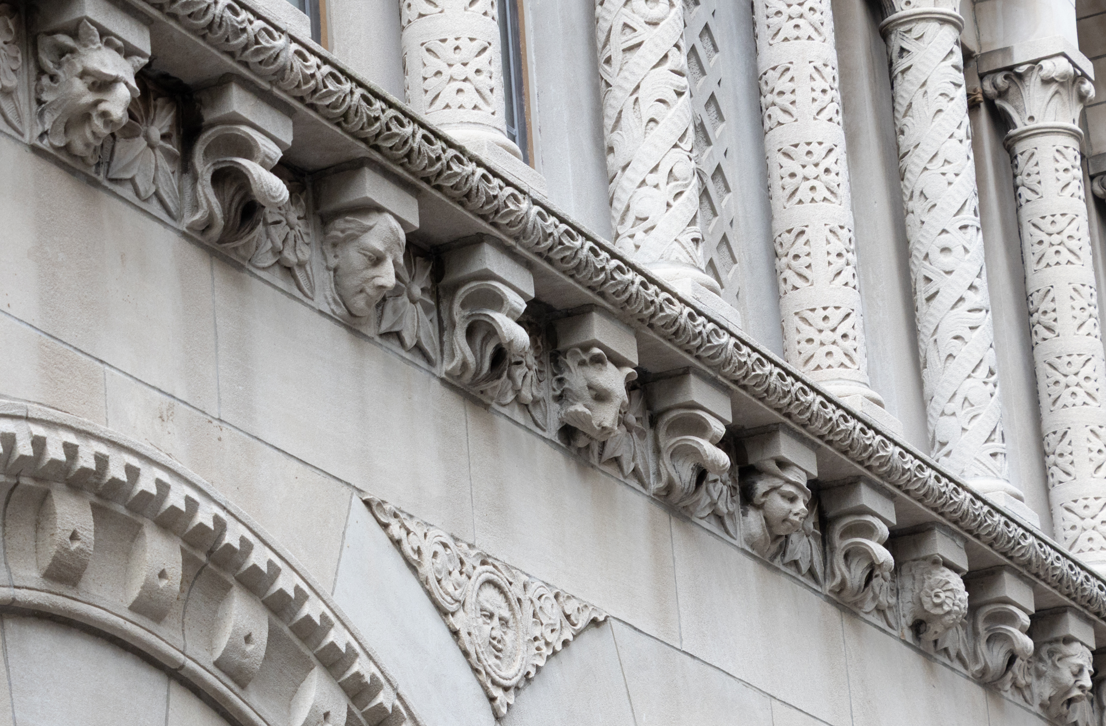 faces as ornament on a building in brooklyn