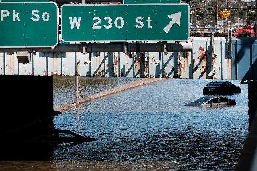 Cars sit abandoned flooded Major Deegan Expressway