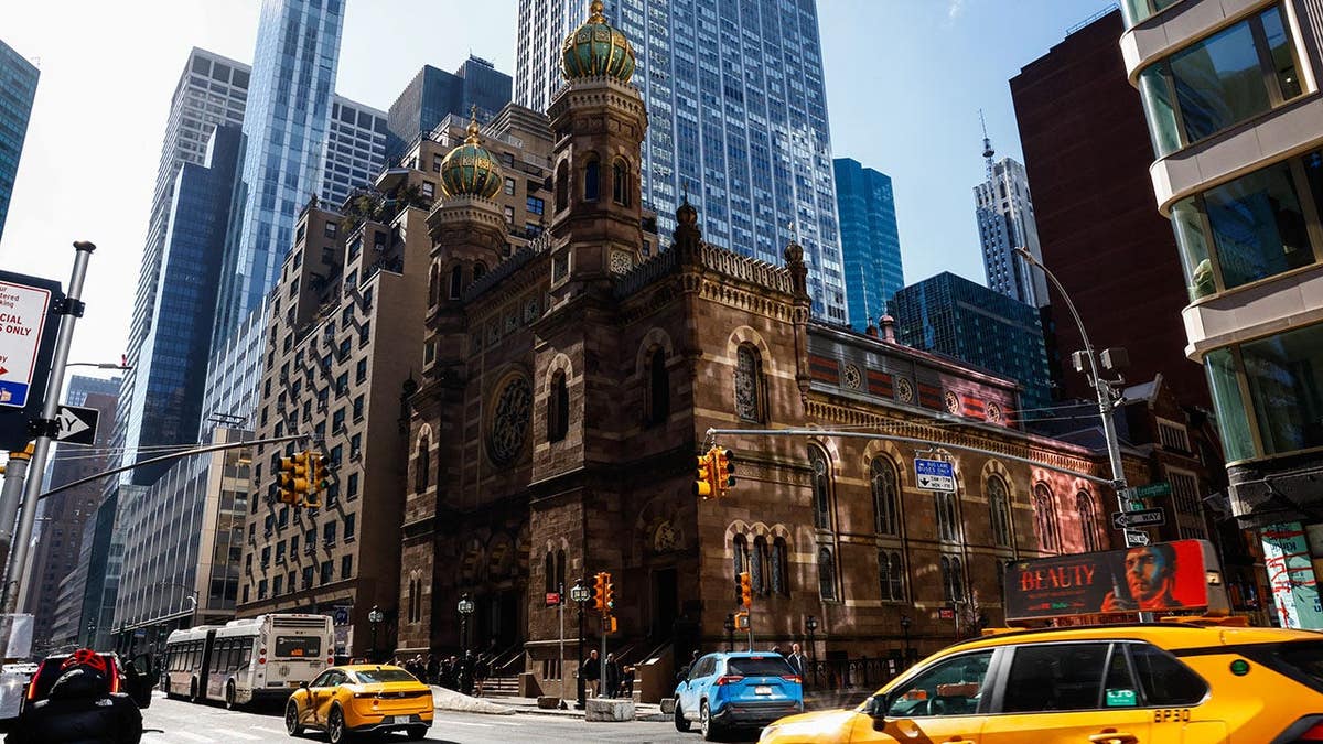 Central Synagogue stands in New York on a city street.