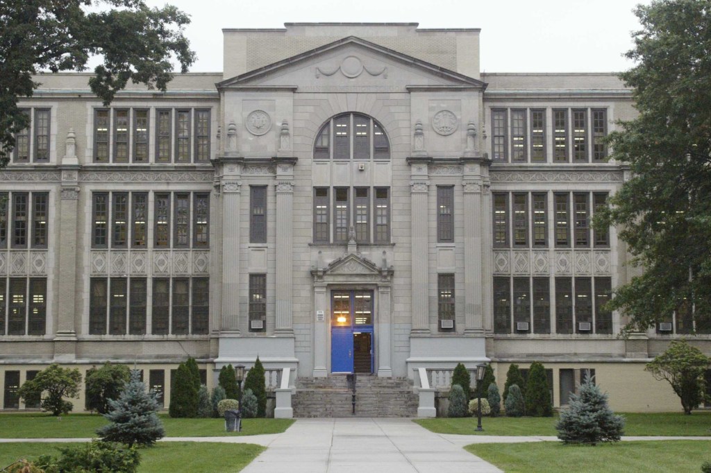 The exterior of John Adams High School, located at 101-01 Rockaway Blvd in Queens