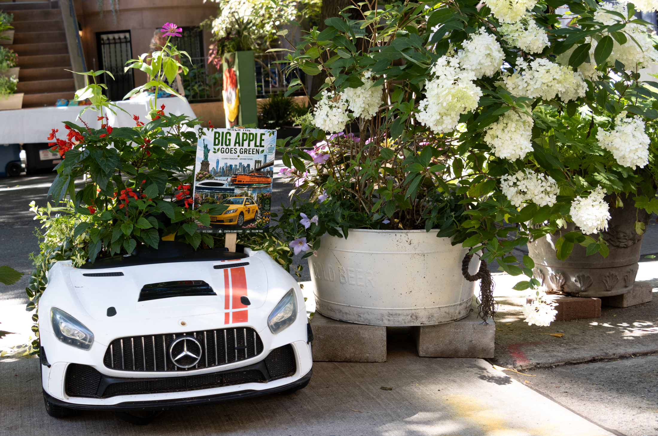 a miniature car planted with flowers