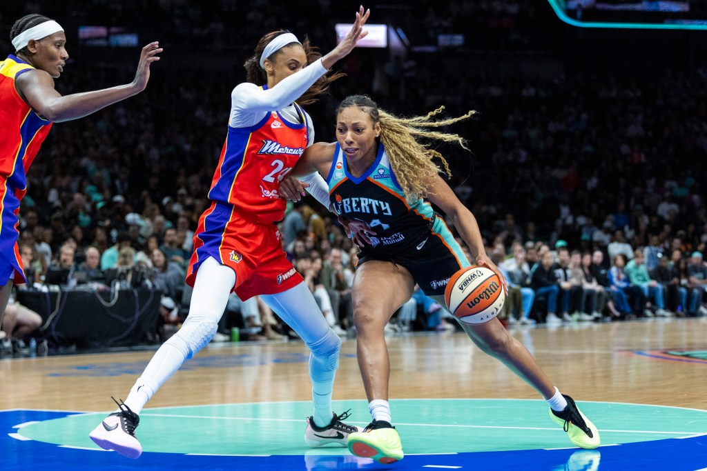 New York Liberty guard-forward Betnijah Laney-Hamilton (44) drives around Phoenix Mercury forward-guard DeWanna Bonner (24).