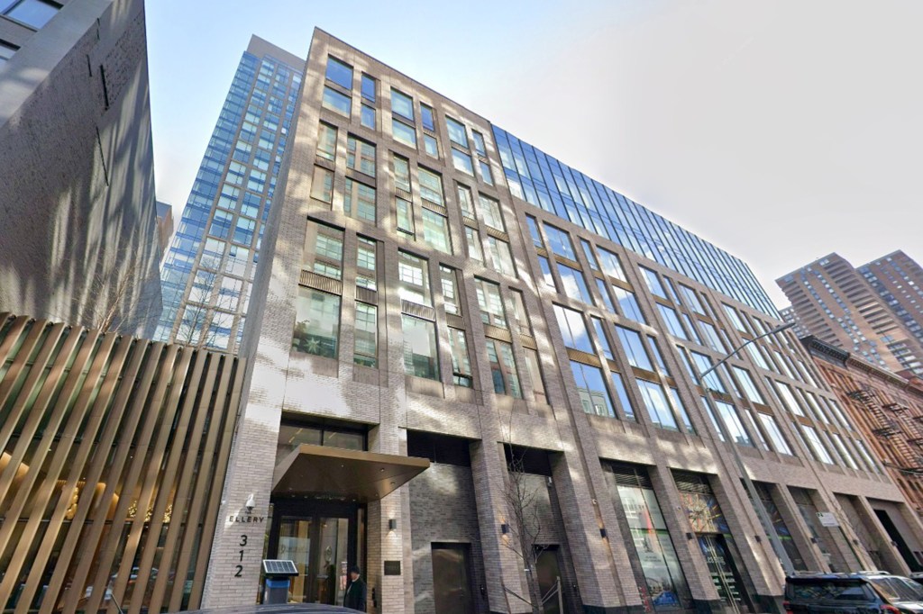 The Ellery NYC building, located at 312 W 43rd St, New York, NY, on a sunny day.
